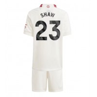Maglie da calcio Manchester United Luke Shaw #23 Terza Maglia Bambino 2023-24 Manica Corta (+ Pantaloni corti)